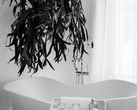 grayscale-photography-of-bathtub-near-window-1416244